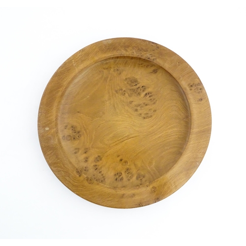 1321 - Treen : A 20thC turned oak dish of circular form. Approx. 16