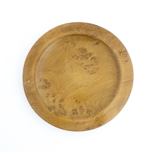 1321 - Treen : A 20thC turned oak dish of circular form. Approx. 16