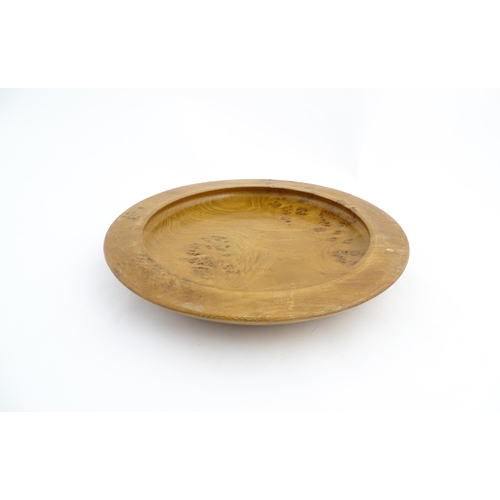 1321 - Treen : A 20thC turned oak dish of circular form. Approx. 16