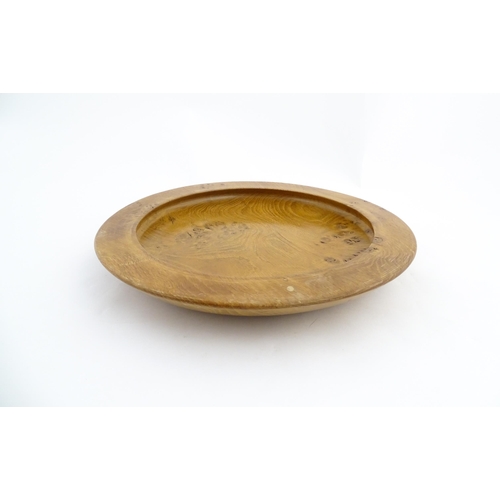 1321 - Treen : A 20thC turned oak dish of circular form. Approx. 16