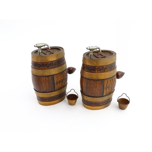 1322 - Two 20thC wooden barrels with carved decoration, and two miniature copper pails. Approx. 9