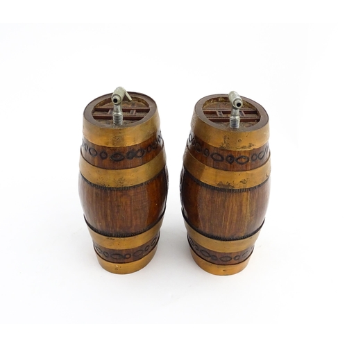 1322 - Two 20thC wooden barrels with carved decoration, and two miniature copper pails. Approx. 9