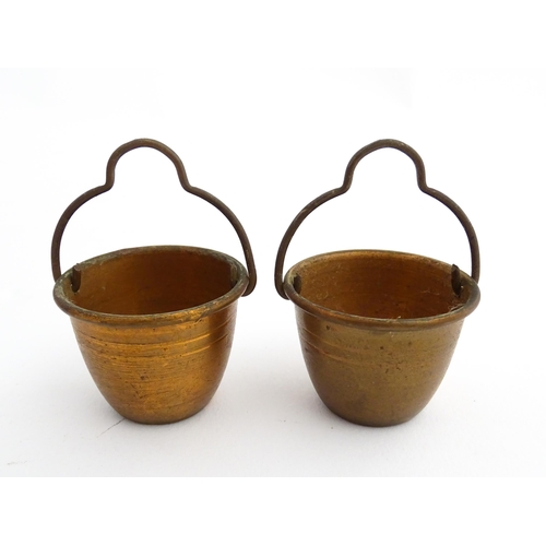 1322 - Two 20thC wooden barrels with carved decoration, and two miniature copper pails. Approx. 9