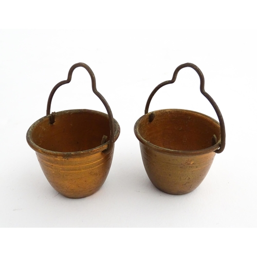 1322 - Two 20thC wooden barrels with carved decoration, and two miniature copper pails. Approx. 9