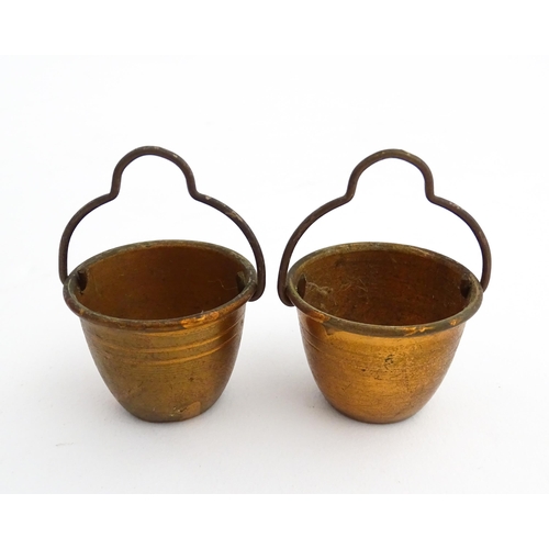 1322 - Two 20thC wooden barrels with carved decoration, and two miniature copper pails. Approx. 9