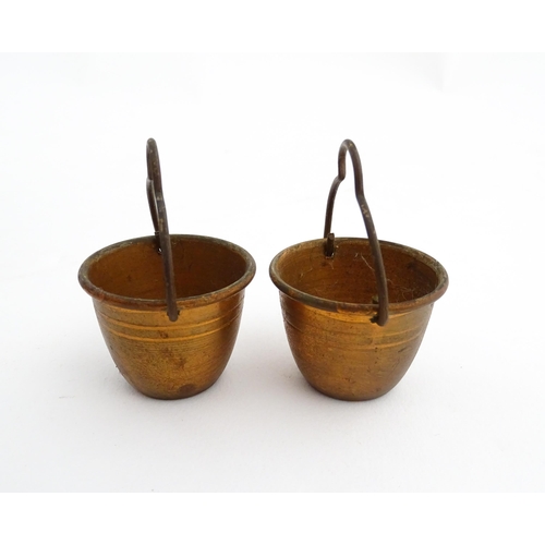 1322 - Two 20thC wooden barrels with carved decoration, and two miniature copper pails. Approx. 9