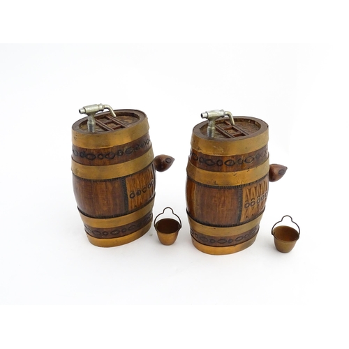 1322 - Two 20thC wooden barrels with carved decoration, and two miniature copper pails. Approx. 9