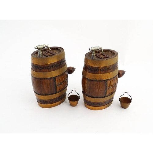 1322 - Two 20thC wooden barrels with carved decoration, and two miniature copper pails. Approx. 9