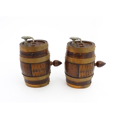 1322 - Two 20thC wooden barrels with carved decoration, and two miniature copper pails. Approx. 9