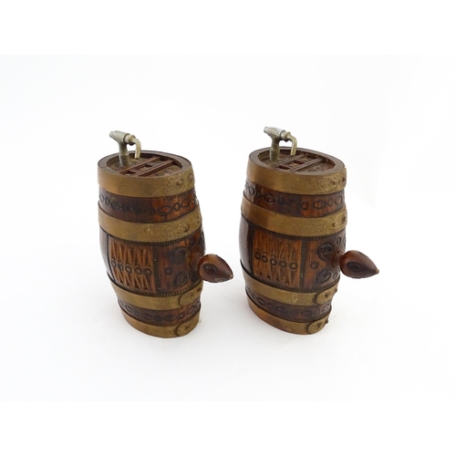 1322 - Two 20thC wooden barrels with carved decoration, and two miniature copper pails. Approx. 9