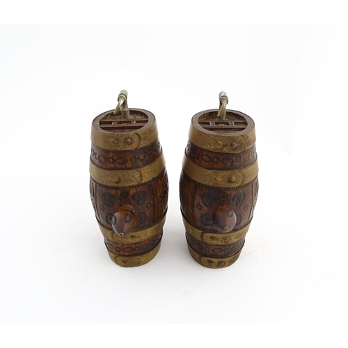 1322 - Two 20thC wooden barrels with carved decoration, and two miniature copper pails. Approx. 9