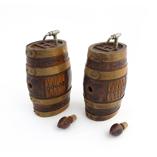 1322 - Two 20thC wooden barrels with carved decoration, and two miniature copper pails. Approx. 9