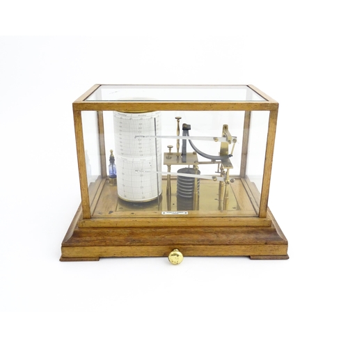 1323 - Meteorology & Scientific Interest: A 20thC Negretti & Zambra oak cased thermobarograph with single d... 