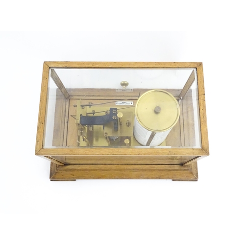 1323 - Meteorology & Scientific Interest: A 20thC Negretti & Zambra oak cased thermobarograph with single d... 