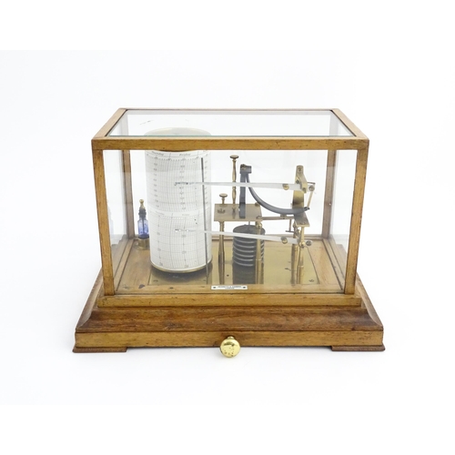 1323 - Meteorology & Scientific Interest: A 20thC Negretti & Zambra oak cased thermobarograph with single d... 