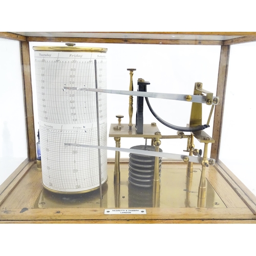 1323 - Meteorology & Scientific Interest: A 20thC Negretti & Zambra oak cased thermobarograph with single d... 