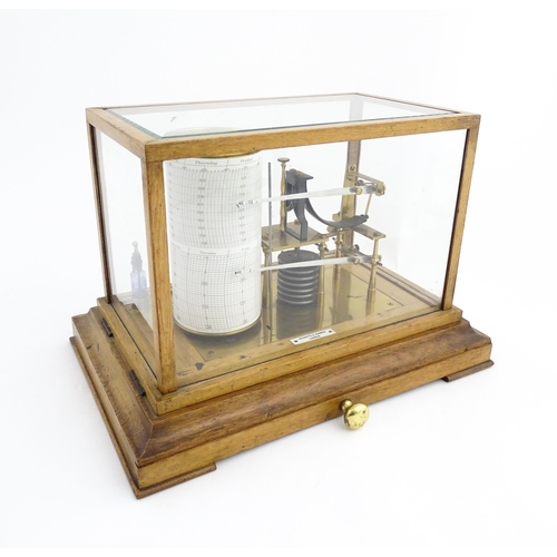 1323 - Meteorology & Scientific Interest: A 20thC Negretti & Zambra oak cased thermobarograph with single d... 