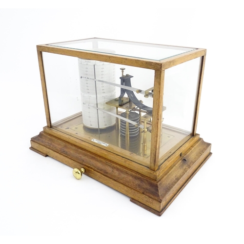 1323 - Meteorology & Scientific Interest: A 20thC Negretti & Zambra oak cased thermobarograph with single d... 