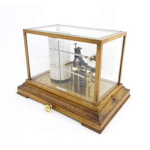 1323 - Meteorology & Scientific Interest: A 20thC Negretti & Zambra oak cased thermobarograph with single d... 