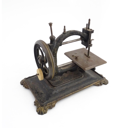 1330 - A late 19thC German manual hand crank sewing machine, possibly by Guhl & Harbeck. Approx. 9 1/4