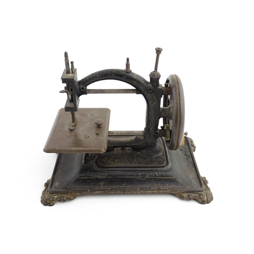 1330 - A late 19thC German manual hand crank sewing machine, possibly by Guhl & Harbeck. Approx. 9 1/4