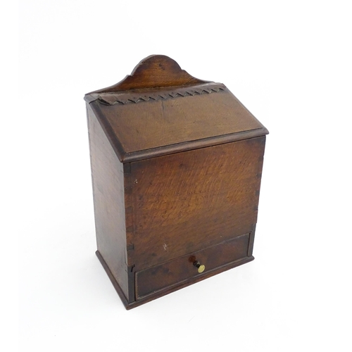 1331 - Treen : A 19thC oak wall mounted salt box, the lid with brass studded leather hinge, the base with s... 