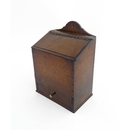 1331 - Treen : A 19thC oak wall mounted salt box, the lid with brass studded leather hinge, the base with s... 