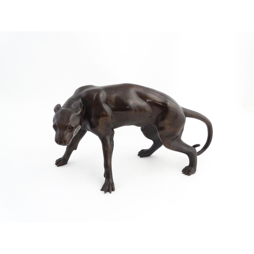 1333 - A 20thC cast bronze sculpture modelled as a panther / big cat. Approx. 13