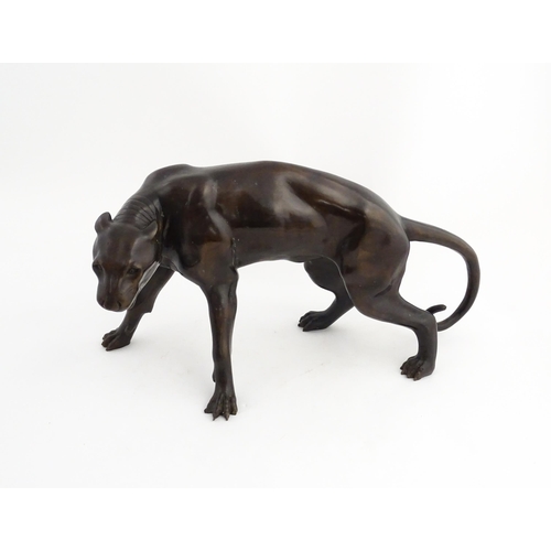 1333 - A 20thC cast bronze sculpture modelled as a panther / big cat. Approx. 13