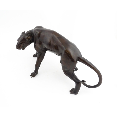 1333 - A 20thC cast bronze sculpture modelled as a panther / big cat. Approx. 13