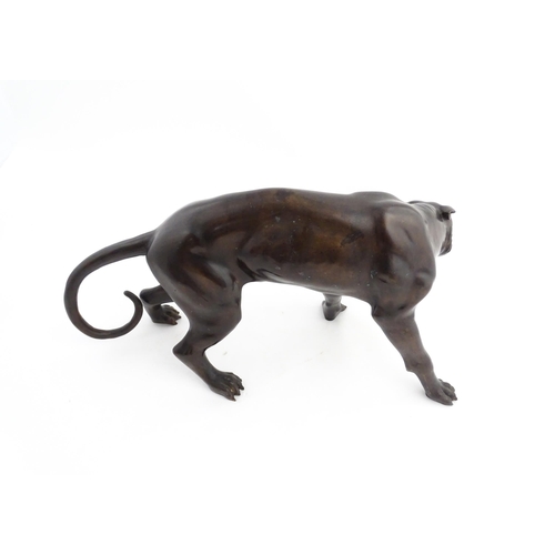 1333 - A 20thC cast bronze sculpture modelled as a panther / big cat. Approx. 13