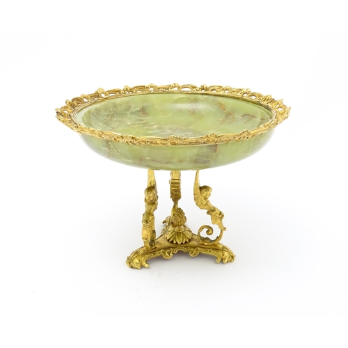 1343 - A Continental onyx tazza with gilt metal mounts and triform base with caryatid detail. Approx. 9 1/2... 