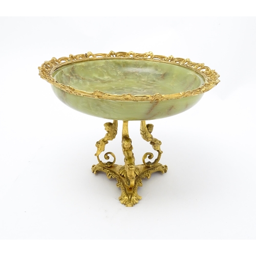 1343 - A Continental onyx tazza with gilt metal mounts and triform base with caryatid detail. Approx. 9 1/2... 