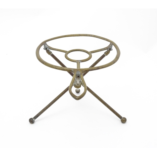 1344 - An early 20thC brass folding trivet with tripod base, stamped 'W T & S' (William Tonks & Sons) with ... 