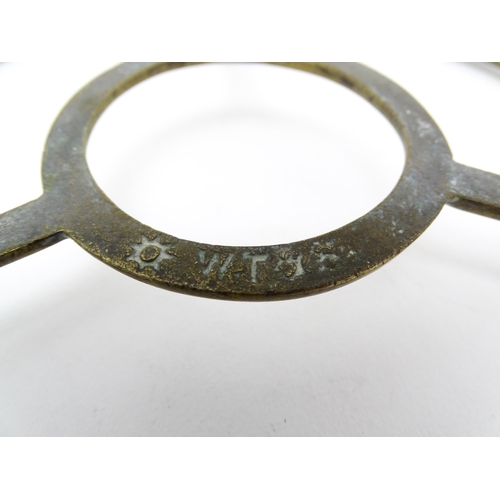 1344 - An early 20thC brass folding trivet with tripod base, stamped 'W T & S' (William Tonks & Sons) with ... 