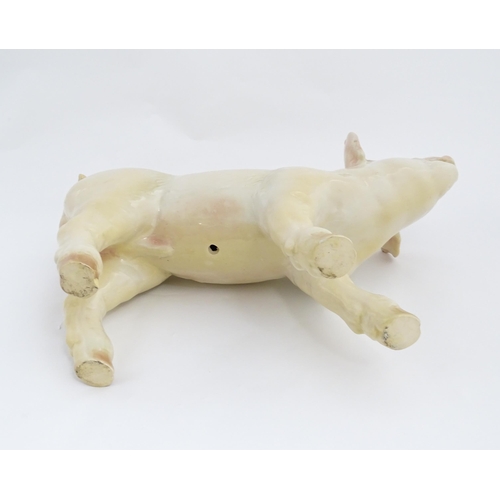 1347 - A 20thC butcher's advertising ceramic model of a standing pig with painted features. Approx. 14 1/2