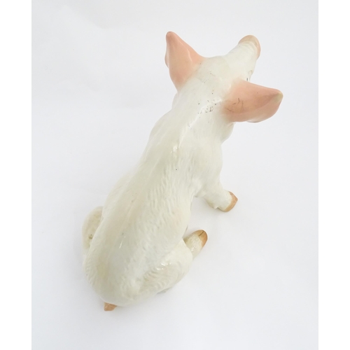 1348 - A 20thC butcher's advertising ceramic model of a seated pig with painted features. Approx. 12 1/4