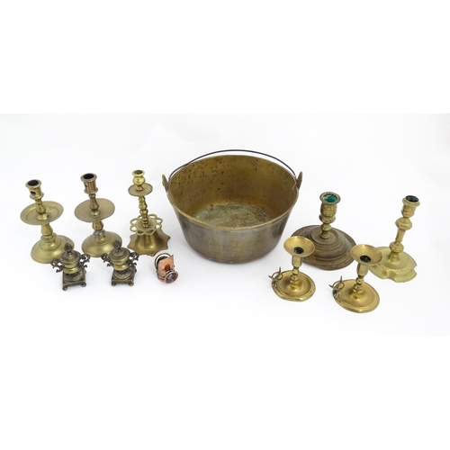 1350 - A quantity of 18thC and later brass wares to include candlesticks, mid drip candlesticks, a pair of ... 