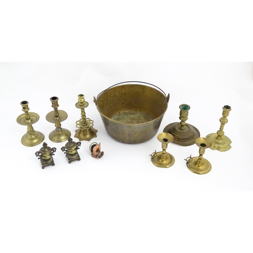 1350 - A quantity of 18thC and later brass wares to include candlesticks, mid drip candlesticks, a pair of ... 