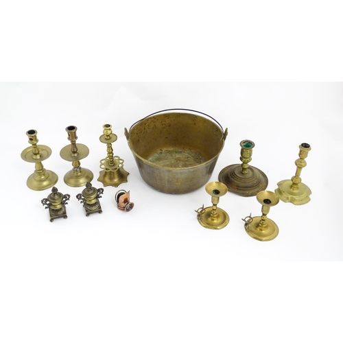 1350 - A quantity of 18thC and later brass wares to include candlesticks, mid drip candlesticks, a pair of ... 