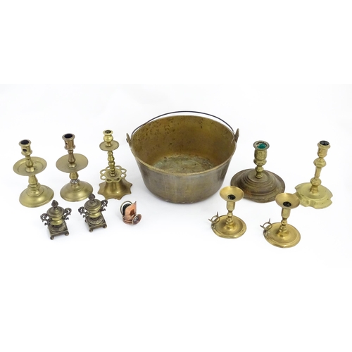 1350 - A quantity of 18thC and later brass wares to include candlesticks, mid drip candlesticks, a pair of ... 