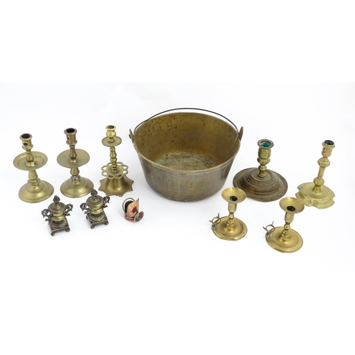 1350 - A quantity of 18thC and later brass wares to include candlesticks, mid drip candlesticks, a pair of ... 