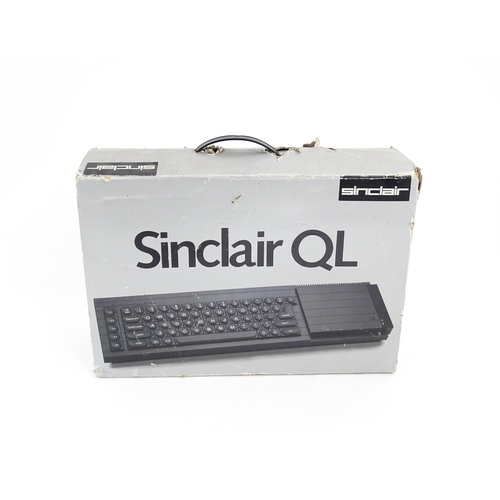 1351 - A boxed Sinclair QL personal computer (1984-1986), with cables and manual, approx 17