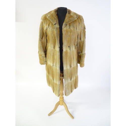 1384 - Vintage fashion / clothing: A vintage, thigh length fur coat. Bust approx. 38