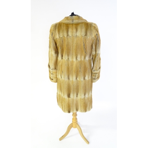 1384 - Vintage fashion / clothing: A vintage, thigh length fur coat. Bust approx. 38