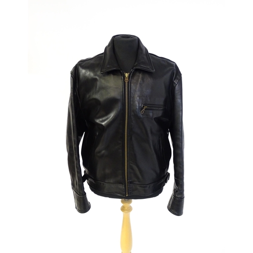 1393 - Vintage fashion / clothing: A black leather jacket by Skin Deep with zip fastening and zipped breast... 