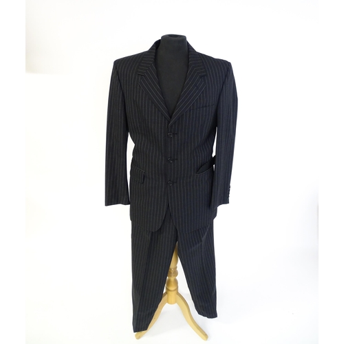 1395 - Vintage fashion / clothing: A dark grey pinstripe suit by Roderick Charles, comprising a single brea... 