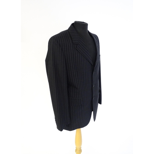 1395 - Vintage fashion / clothing: A dark grey pinstripe suit by Roderick Charles, comprising a single brea... 