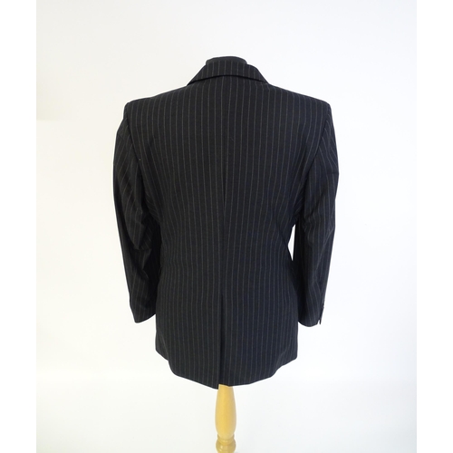 1395 - Vintage fashion / clothing: A dark grey pinstripe suit by Roderick Charles, comprising a single brea... 