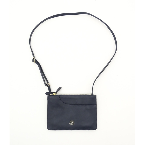 1402 - Vintage fashion / clothing: A Radley navy leather Pocket crossbody bag. Approx. 8 1/2